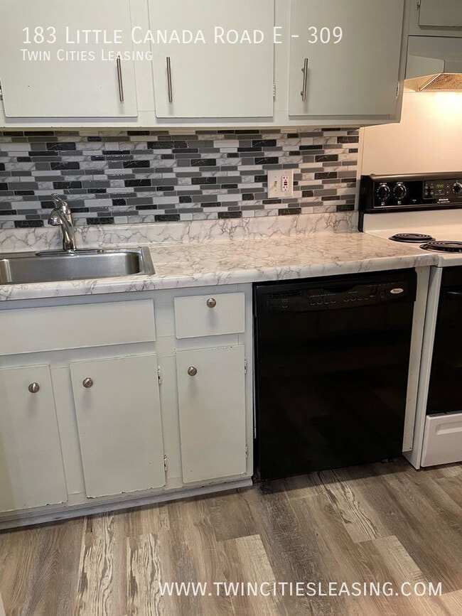 Building Photo - Amenities include a pool, sauna, garage pa...