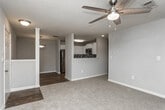 Located at 540 S Carroll Rd in Villa Rica, Georgia, this single-floor residence offers a well-designed layout with a blend of functional and comfortable living spaces. The kitchen is a standout feature, equipped with stainless steel appliances including a refrigerator, electric range, built-in microwave, and dishwasher. Crisp white cabinetry pairs with white countertops and a mosaic tile backsplash, while wood-look flooring ties the space together with a warm, contemporary feel. The living area is bright and welcoming, featuring a ceiling fan, neutral carpet, and a window that invites natural light and outdoor views. Additional carpeted rooms offer generous space and are also bathed in natural light through large windows with blinds, providing a calm and airy atmosphere. At least one bedroom includes a walk-in closet outfitted with wire shelving, offering practical storage solutions. The bathroom is finished with wood-look flooring, a white vanity with a speckled countertop, and a full tub-shower combination with white tile surround and brushed nickel fixtures. Throughout the home, neutral tones, clean lines, and consistent finishes create a cohesive and move-in-ready environment suited for comfortable everyday living.