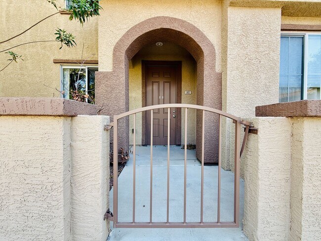 Building Photo - Immaculate and Inviting Two-Story Condo in...