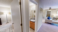 Located at 505 Fox Crossing Blvd in Knoxville, Tennessee, this single-floor, two-bedroom, two-bathroom home offers a well-organized layout with a dedicated office, a combined kitchen and dining area, two closets, a hallway, and a utility room. Neutral wall tones and carpet flooring run throughout, creating a warm, cohesive atmosphere.

The kitchen features light wood cabinetry, granite-look dark countertops, and a full suite of appliances, opening directly into a comfortable dining area with a chandelier overhead. The dedicated office provides a versatile space with a window for natural light and room for multiple workstations. Both bedrooms are carpeted and include windows that invite natural light; the spacious primary bedroom connects to its own bathroom complete with warm wood vanity, dark granite countertop, and a walk-in closet with wire shelving. The second bathroom mirrors the same vanity and countertop design, maintaining a consistent aesthetic throughout. A second closet offers additional storage. Textured ceilings are present throughout, and each room benefits from practical overhead lighting. The thoughtful floor plan balances private and shared spaces, making this home functional and comfortable for everyday living.