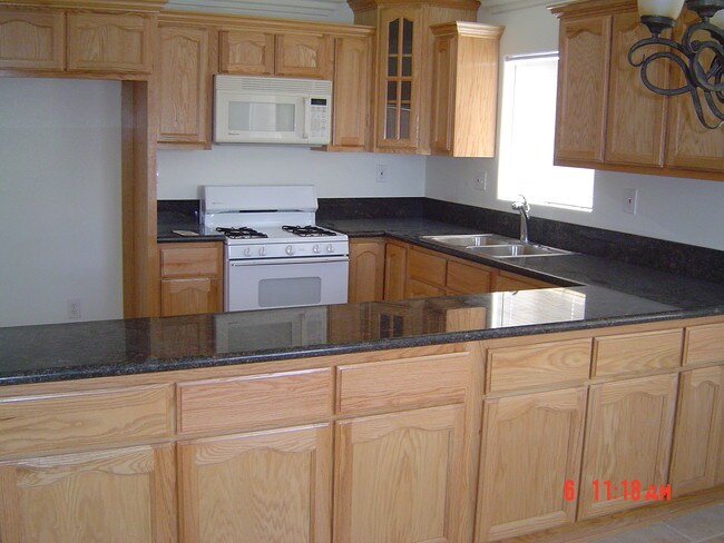 CUSTOM CABINETS WITH GRANITE COUNTERS - 10950 S Figueroa St