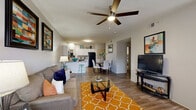 This well-appointed 2-bedroom, 2-bathroom residence in Memphis, TN offers a thoughtfully designed, single-level floor plan that maximizes comfort and functionality. The open-concept living and dining area serves as the heart of the home, featuring wood-style flooring, a ceiling fan with light fixture, and large windows that invite natural light while providing outdoor views. A sliding glass door leads to an exterior space, enhancing the sense of openness.

The kitchen is a standout feature, outfitted with crisp white cabinetry, stone-look countertops, black appliances including a refrigerator, dishwasher, and range, and a peninsula breakfast bar with seating — ideal for casual dining or entertaining.

Both bedrooms are generously sized, appointed with plush carpet, ceiling fans, and ample natural light from well-placed windows. Each bedroom includes closet storage, with the primary bedroom offering a notably spacious layout. The two full bathrooms are finished with white cabinetry, light countertops, and tub-shower combinations with sliding glass enclosures, complemented by wood-style tile flooring.

A hallway connects the private quarters to the common areas, with two dedicated closets providing additional storage. The overall ambiance is clean, bright, and welcoming throughout.
