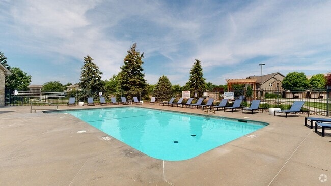 Dive into relaxation at our sparkling swimming pool. - Stone Ridge Estates Apartments & Duplexes