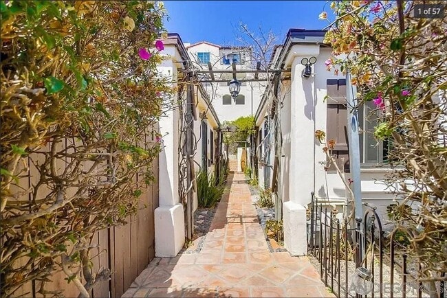 Building Photo - Charming, Fully Furnished Spanish-Style Du...