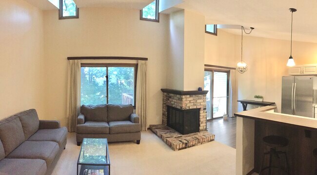 Open-concept living space, with vaulted ceilings. - 1511 Trapp Court