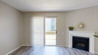 Located at 1840 Nelson in West Covina, CA, this single-floor, one-bedroom, one-bathroom unit offers a thoughtfully designed layout with a clean, neutral aesthetic throughout. Light wood-style laminate flooring flows seamlessly across every room, creating a bright and cohesive feel.

The spacious living room is a standout, featuring a classic white-mantled fireplace and a sliding glass door with vertical blinds that opens to an outdoor patio, inviting natural light and outdoor views. A ceiling fan overhead adds to the comfort of the open living and dining areas, which connect fluidly to the rest of the unit.

The kitchen is well-appointed with crisp white cabinetry offering generous storage, light stone-look countertops, stainless steel appliances including a gas range, microwave, and dishwasher, plus a skylight-style ceiling fixture that brightens the workspace.

The bedroom is a comfortable, private retreat featuring two corner windows that fill the room with natural light and views of the surrounding greenery. Two closets provide ample storage. The full bathroom includes a clean, white tub-shower combination with chrome fixtures.

Textured ceilings and warm beige walls complete the interior, lending a timeless and well-maintained character throughout this efficiently designed West Covina residence.