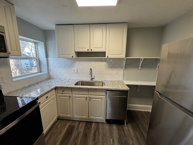 Kitchen with new appliances and granite counters - 1710 E 296th St