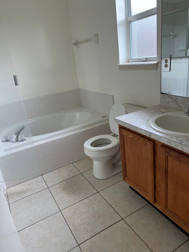 The master bath features a relaxing garden tub and dual sinks — perfect for a couple. - 5374 Lacy Jane Way