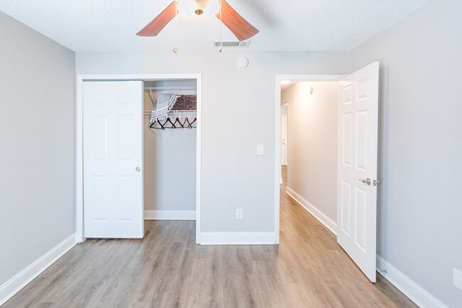 Bedroom with wood plank flooring - Sun Bay Palms at South Tampa