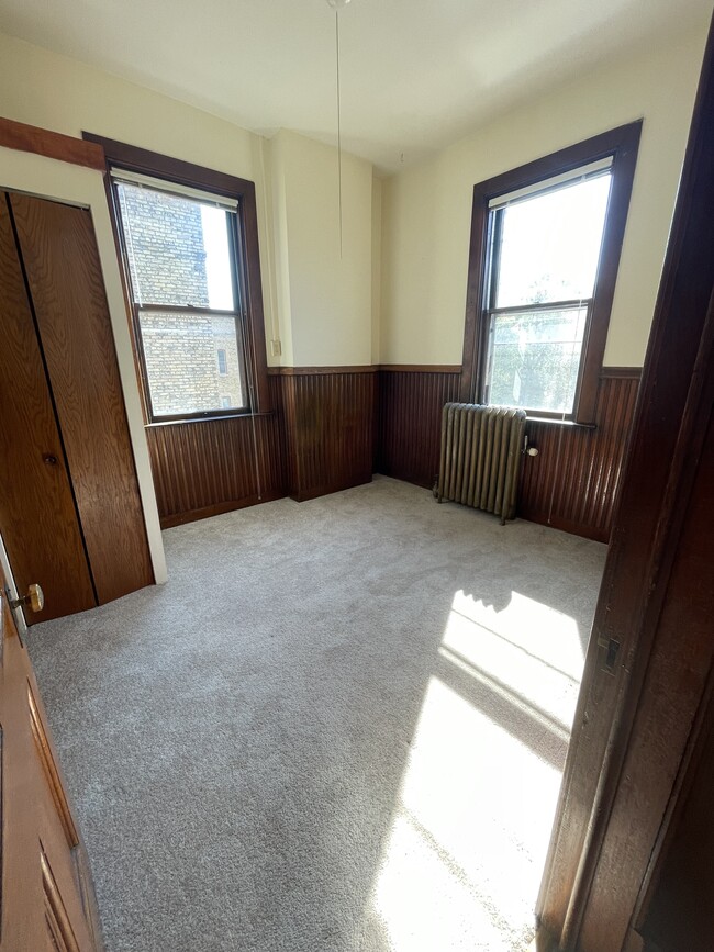 Bedroom - Carpet and Original Wood Beadboard - Best Apartments