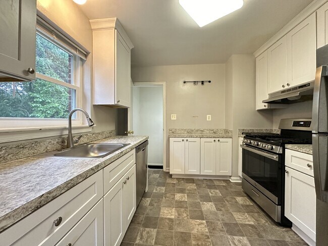 Building Photo - This classic brick rambler, located just around the corner from the West Falls Church Metro Stati...
