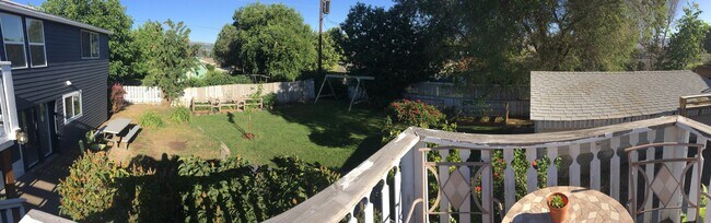 Shared fenced-in backyard (swings removed) (although upstairs tenant currently does not use at all). - 2415 E 12th St