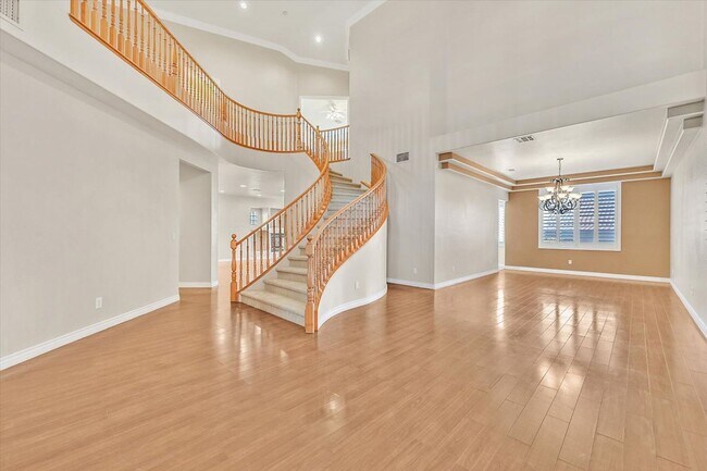 Building Photo - Desirable Home with 5 Bedrooms and 4 Bathrooms in Guard Gated Community!