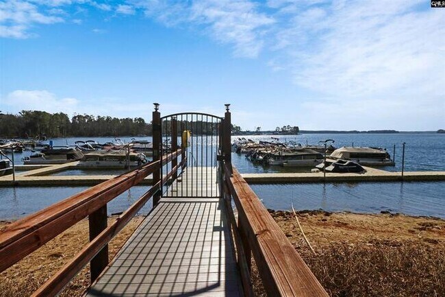 Building Photo - Deeded Boat Slip Comes with Home in Gated ...