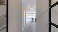 Located at 17W720 Butterfield Rd in Oakbrook Terrace, IL, this well-designed one-bedroom, one-bathroom residence offers a smart and functional single-floor layout. The entrance leads into a bright, open living room finished with plush carpeting and a large sliding glass door that floods the space with natural light and provides direct access to a private patio with outdoor views. The open flow between the living room and kitchen enhances the sense of space — the kitchen features wood-toned cabinetry, dark countertops, and stainless steel appliances over hardwood-style flooring, creating a functional and cohesive design. The bedroom is a cozy retreat featuring frosted sliding closet doors, warm neutral walls, and wall-mounted lighting. Curated wall art adds a modern aesthetic touch. Direct access to the full bathroom from the bedroom adds convenience; the bathroom includes tile flooring, a full soaking tub with white tile surround, and a wood-toned vanity with ample storage. Throughout the residence, a consistent neutral color palette and clean finishes contribute to a calm, modern ambiance well-suited for comfortable everyday living.
