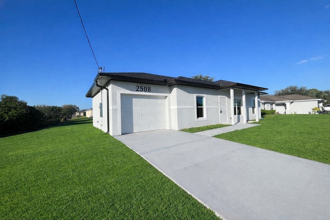 Building Photo - STUNNING NEW 3BR/2BA HOME WITH GARAGE -IN PRIME SW LEHIGH ACRES LOCATION