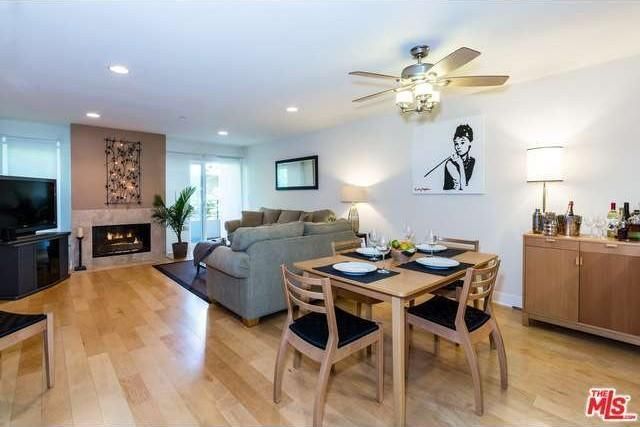 Fireplace in living room/dining room area - 1951 N Beachwood Dr