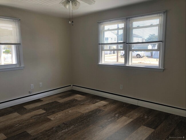 Living Area Showing Example of New LVP Flooring (Photo of downstairs unit with same layout) - 109 W Brigantine Ave