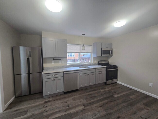 Foto del edificio - NEW LISTING: 1-Bed w/ Private Laundry & Parking