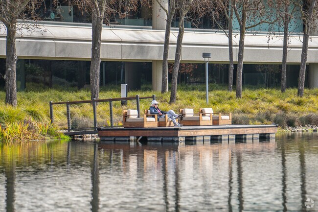 A lady enjoys the sun on the dock at Roundhouse, San Ramon, CA.