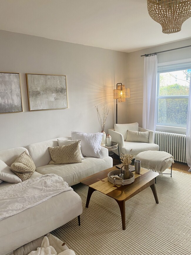 Living room with plenty of natural light and high-efficiency radiant heat for lower utility bills - 519 N Payne St