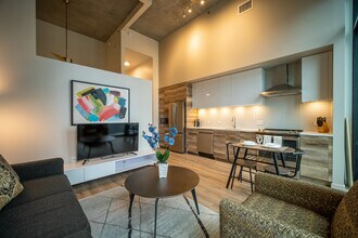 The living room and kitchen of The Rookie at One Cardinal Way - One Cardinal Way