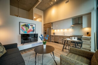 The living room and kitchen of The Rookie at One Cardinal Way - One Cardinal Way