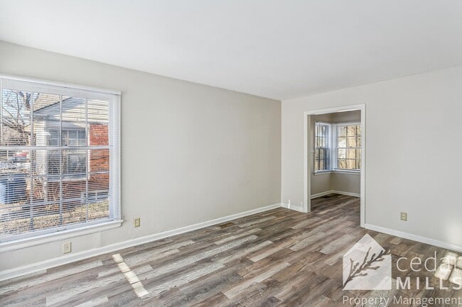 Building Photo - Updated, clean unit, with LARGE basement for storage!