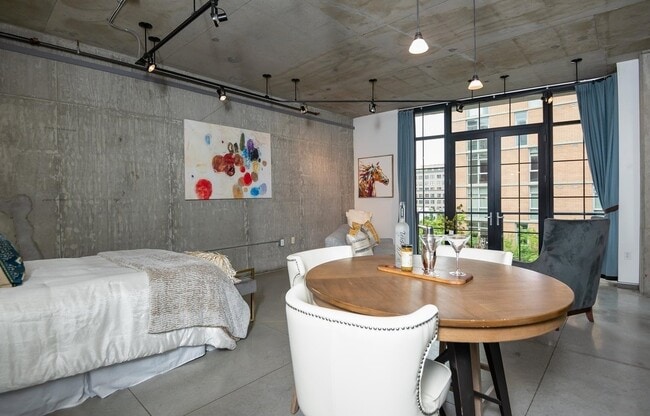 Building Photo - Rare Availability in the Streetcar Lofts, Parking, and Some Utilities Included