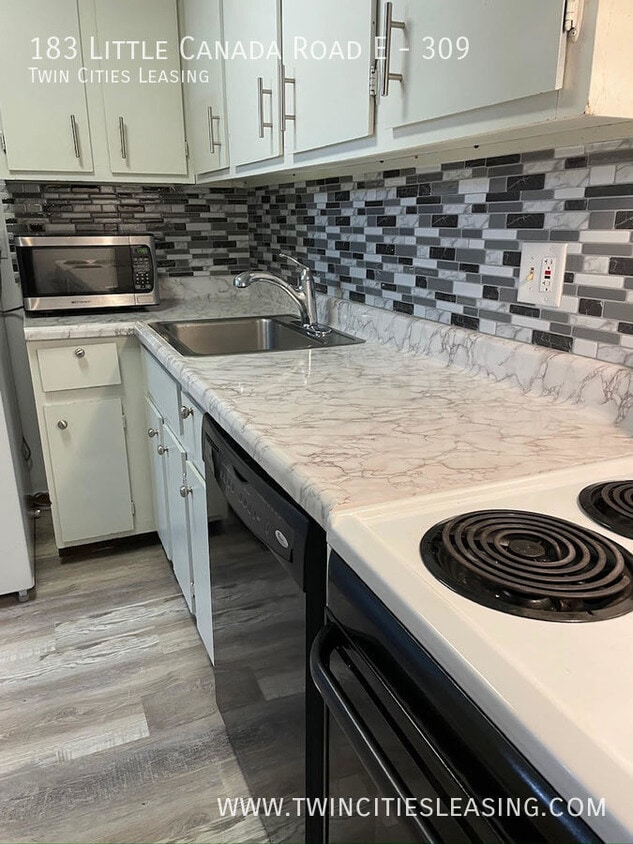 Primary Photo - Amenities include a pool, sauna, garage pa...