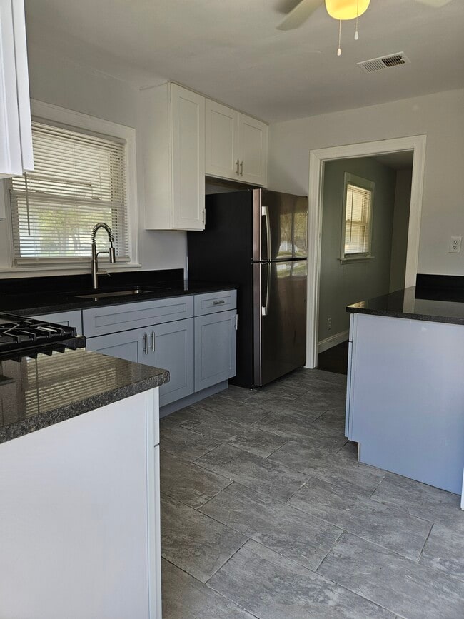 Building Photo - 1217 W 63rd Ave