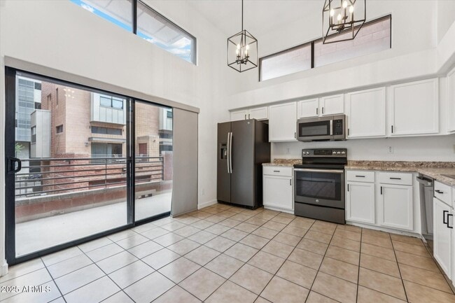 Kitchen with skylights and large balcony - 330 S Farmer Ave Townhome