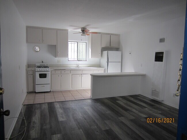 Front room and kitchen - 10946 National Blvd