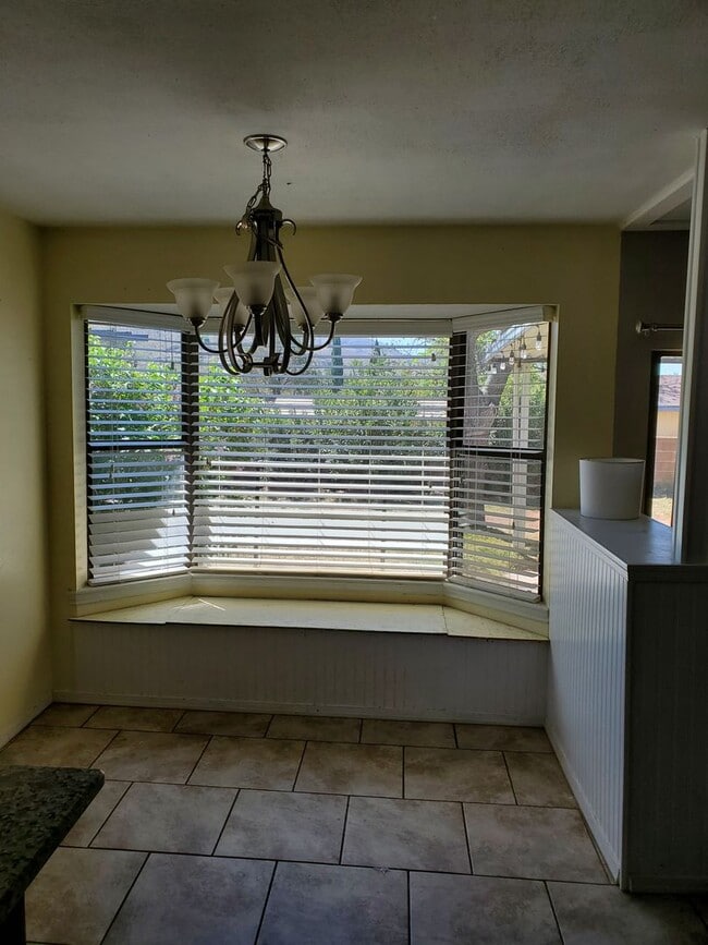 Building Photo - 3 Bedroom, 2 Bath with large fenced in bac...