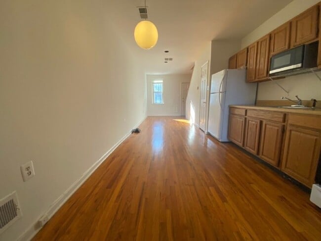 Building Photo - A charming two bedroom one and one half  bath row house located just off New Jersey Ave in the Sh...