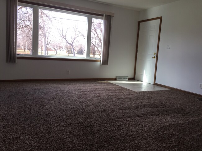 Living Room w/ Picture Window - 1414 N Baltimore Ave