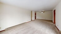 This 940 square foot apartment offers a practical and comfortable living space. The layout includes two bedrooms, one bathroom, a living room, and two kitchen areas. The primary bedroom measures 150 square feet, providing ample space for rest and relaxation.

The bathroom features a modern design with marble-like countertops, a large mirror, and a combination shower/bathtub. The kitchen is well-appointed with wooden cabinetry, granite-like countertops, and stainless steel appliances, including a refrigerator and stove. The galley-style layout maximizes efficiency in the cooking area.

Throughout the apartment, neutral-toned carpeting adds warmth and comfort to the bedrooms and living areas. Large windows in each room allow natural light to flood the space, creating a bright and airy atmosphere. Some windows offer scenic winter views, adding to the apartment's charm.

The living room is spacious, with ample room for furniture arrangements. A sliding glass door leads to a balcony, perfect for enjoying fresh air and outdoor views. The apartment also features closet space for storage, baseboard heating for comfort during colder months, and a ceiling fan for air circulation.

Located at 7722 Carrington Dr Apt E in Madison, WI, this single-floor apartment combines functionality with comfort, making it an ideal living space for various lifestyles.