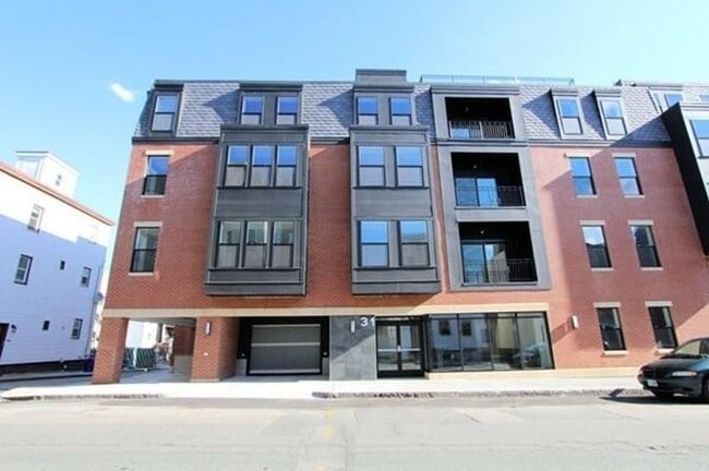 Building Photo - Room Available in Modern 2BR Condo – Jeffr...