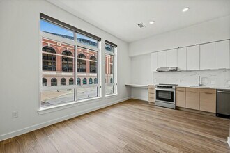 The living room and kitchen of The 1972 - One Rangers Way