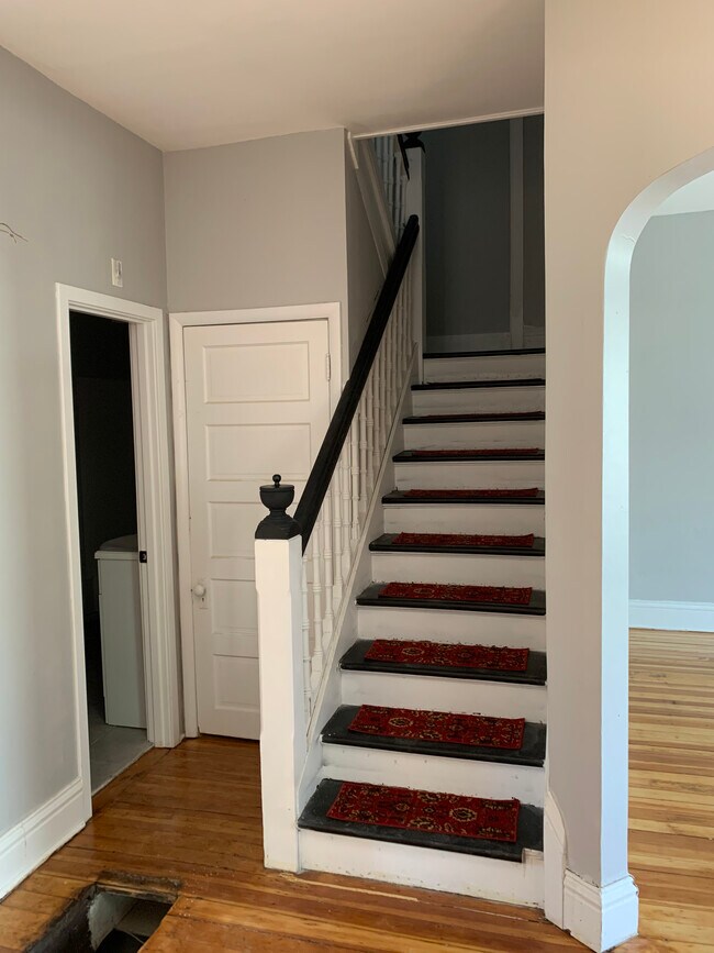 Closed door is to the full walkout basement with 9’ ceiling and laundry. - 1312 Park Ave