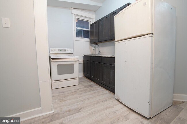 Building Photo - 7022 Woodland Ave