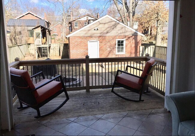 Sun room opens to deck and backyard with firepit - 7023 Pershing Ave