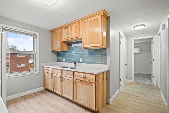Glass tile backsplash, new light fixtures, trim and paint - 1839 E Oklahoma Ave