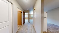 Located at 206 E 15th Ave in Ellensburg, WA, this one-bedroom, one-bathroom unit offers a practical and efficiently designed single-floor layout. A carpeted hallway serves as the central spine of the home, connecting all rooms and providing a clean, cohesive flow throughout the space.

The living room is comfortably sized with soft carpet flooring, neutral-toned walls, and a window that allows natural light to fill the room while offering views of the surrounding neighborhood. A wall-mounted HVAC unit ensures year-round climate control.

The kitchen is well-appointed with warm wood cabinetry, dark granite-style countertops, a stainless steel sink, and white appliances including an electric range, dishwasher, and range hood. Tile flooring adds durability and easy maintenance to this functional cooking space.

The bedroom features plush carpet, sliding wood-panel closet doors providing ample storage, and a window that brings in natural light. Its straightforward layout accommodates a variety of furniture configurations.

The bathroom is clean and functional, featuring a full tub-shower combo, a wood-vanity with dark countertop, tile flooring, and bright white fixtures throughout. The overall design is practical and well-maintained, making this unit a solid option in the Ellensburg area.