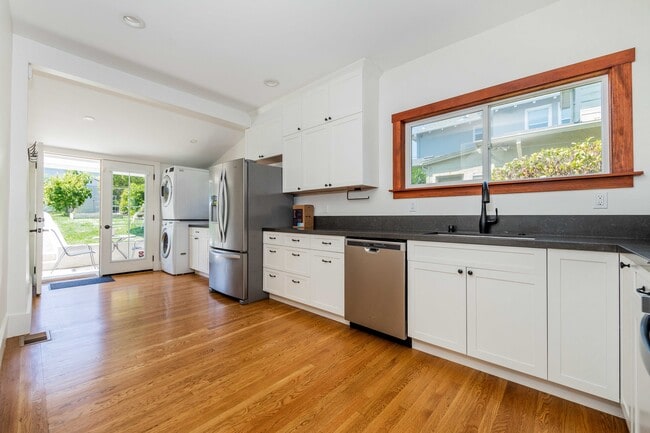 Newly renovated chef's kitchen with updated appliances. - 431 Athol Ave