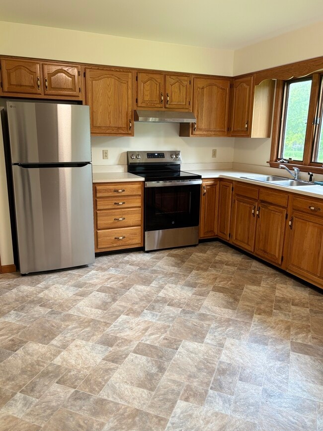 Spacious kitchen with new flooring and appliances - 10 Burke Dr