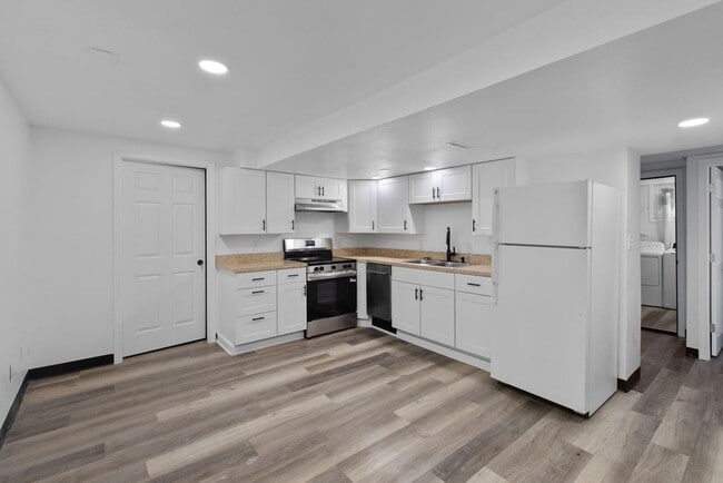 Building Photo - 1/2 Off First Full Month's Rent! 3 Bedroom Basement Apartment with Off Street Parking near UNC Ca...