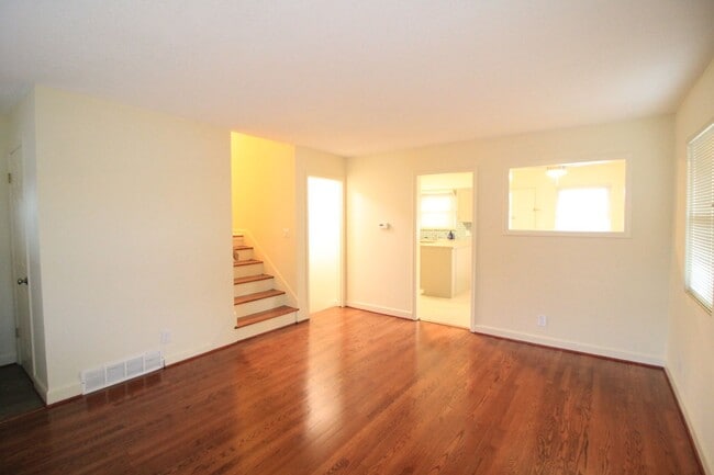 Building Photo - Olathe Duplex w/ Wood Floors, Finished Basement, and a Fenced Yard!