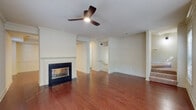 Located in the vibrant Virginia-Highland neighborhood of Atlanta, this three-story home at 550 Rock Springs Ct NE offers a thoughtfully designed layout with quality finishes throughout. The main living area is anchored by rich hardwood flooring, crown molding, and a classic fireplace with a white surround, complemented by a ceiling fan and an open flow that connects to the staircase and adjacent rooms through elegant arched doorways. A half bath on the main level features hardwood floors, a pedestal sink, and an oval mirror with modern lighting. The kitchen is well-equipped with white shaker-style cabinetry, granite countertops, a tile backsplash, stainless steel appliances, and a double sink beneath a window. Upper levels feature carpeted bedrooms, including a room with a large bay window that draws in generous natural light and offers views of surrounding greenery. Additional bedrooms are served by a full bathroom with tile flooring, a soaking tub with shower, granite vanity, and matte black fixtures. Interior hallways are finished with tile flooring, French doors, and panel doors that add architectural character. The space spans three floors, offering versatile living arrangements suited to a variety of needs.