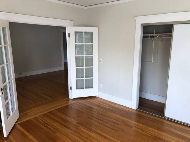 Large Bedroom looking into living room through glass, French doors - 600 Brooklyn Ave